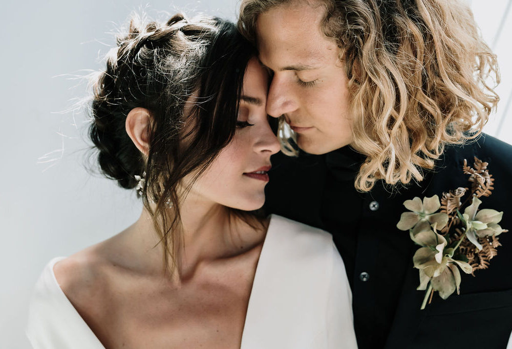 bride and groom portrait featuring bridal hairstyle and makeup by kelli thomsen beauty
